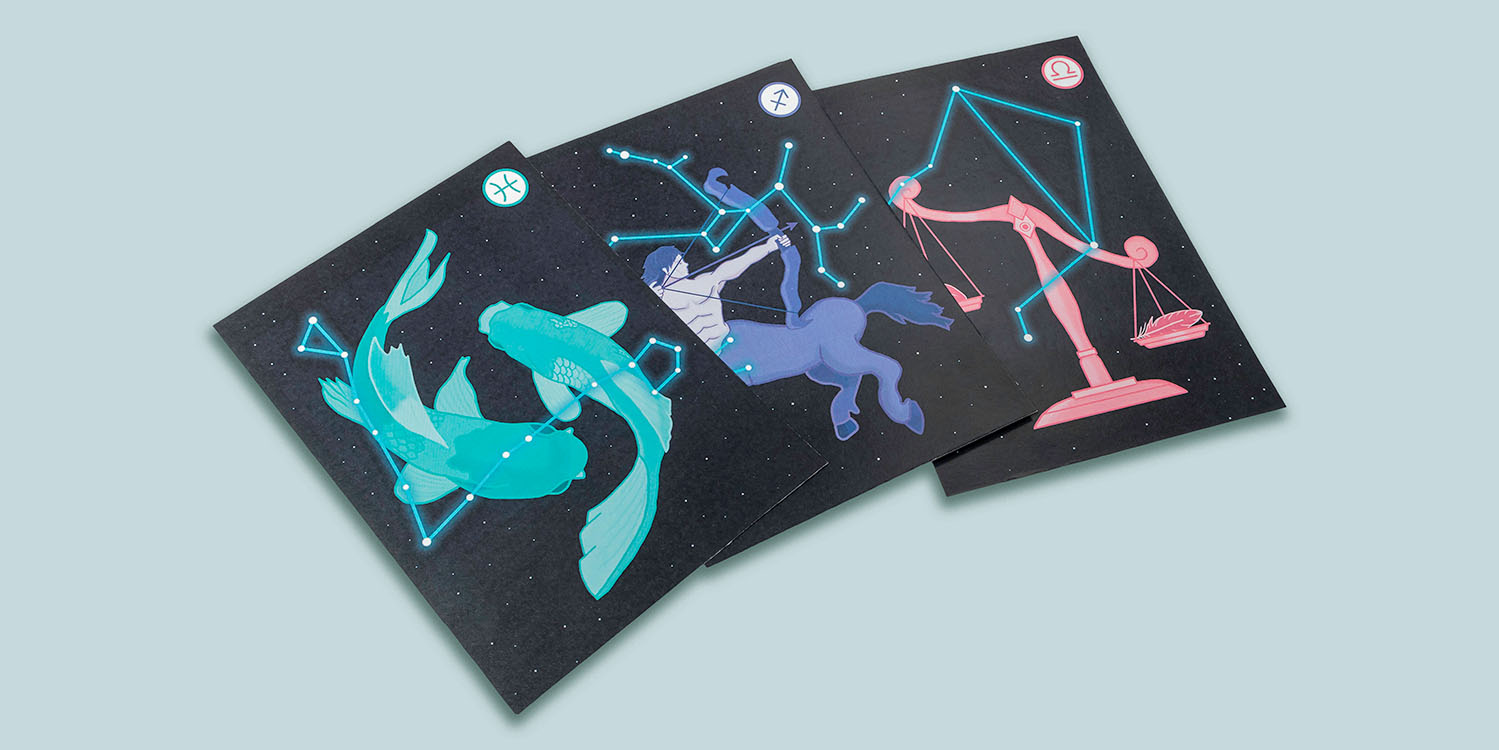 photograph of a stack of three illustrated cards