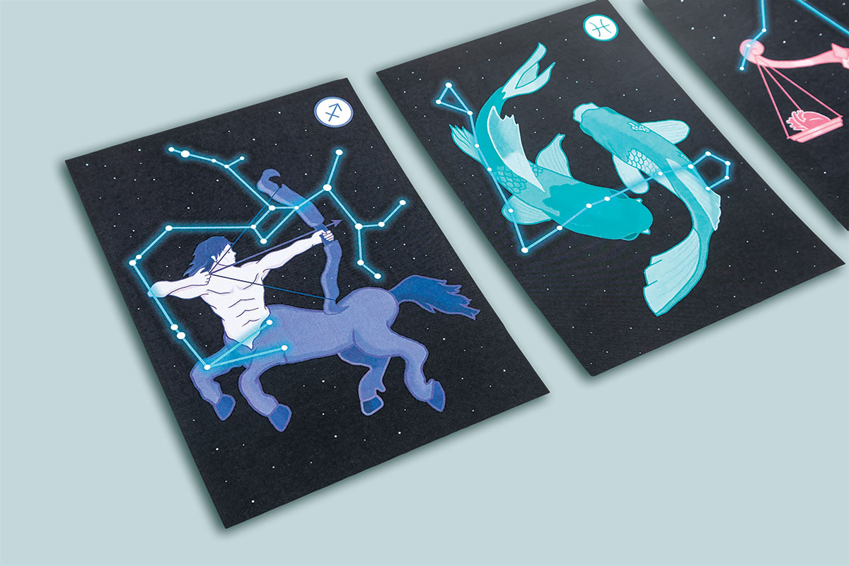 Photograph of 3 illustrated cards.